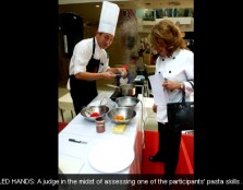 SKILLED HANDS: A judge in the midst of assessing one of the participants' pasta skills