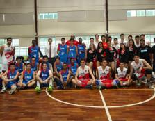 [SPARRING PARTNERS]: After the game, UCSI basketball team (in blue jersey) and Westports Malaysia Dragons struck a pose for the camera.