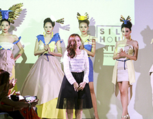  SPREADING HER WINGS: Evis Chow Sook Kuen, the winner of the Best Collection Award, with her designs depicting origami birds in flight.