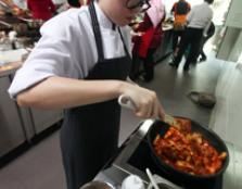 Queeny Cheong preparing her winning dish.