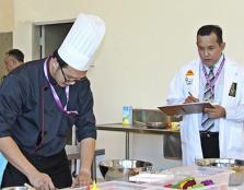 Christopher Wan Sageng (left) working on his dish during the Penang International Halal Chef Challenge 2015 (PIHCC)