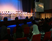 Students from the School of Nursing holding lit candles and singing along to Michael Jackson’s “Heal the World”.