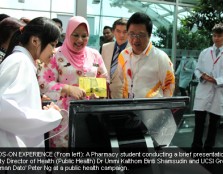 A Pharmacy student conducting a brief presentation for Deputy Director of Health