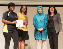  Student representatives from SMK Taman Tun Dr Ismail receive the 2nd Runner Up prize with a smile.