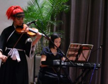 Ashley Tan (Keyboardist) and Quek (Violinist) from UCSI University’s School of Music entertaining the crowd with a popular tune from an anime show. Quek is dressed as Renji from the popular anime show Bleach