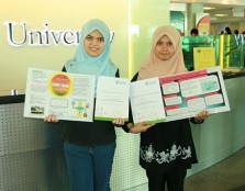 UCSI University A-Level Academy students Siti Nur Aelina Abu Bakar (left) and Hafizah Razy hold up their winning posters after being selected to win a free trip to England to attend the University of Bath International Science Summer School.