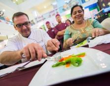  [THE GOURMET EXPERTS]: Judges Thomas Schmid, Executive Chef, Borneo Convention Centre Kuching (BCCK) and Jasbir Kaur, MasterChef Asia finalist evaluating one of the dishes.