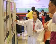  AN EARLY START: A UCSI pharmacy student explaining healthcare-related information to two visitors of the Annual Public Health Campaign.