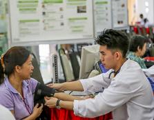 FREE HEALTH CHECKS: UCSI pharmacy students conducting free health checks including blood pressure tests during the UCSI Annual Public Health Campaign.