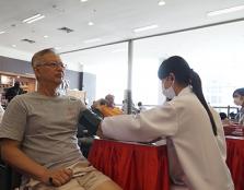 GIVING BACK: A UCSI pharmacy student taking a member of the public’s blood pressure during the Public Health Campaign. Other free tests include the urine dipstick test and waist-to-hip ratio test.