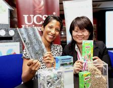  Manjula Murugesan (left) holds a sample of the sturdy roof tile made from drink cartons similar to the one held by Asst Prof Dr Crystale Lim.