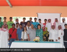 A sun tanned team of national day revelers.