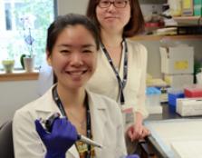 Tan Jia Wei (left) pictured with postdoctoral researcher Yuefei Huang at one of Harvard's labs.
