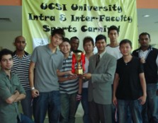 Former Vice President of Student Affairs, Prof. Dr. Lachman Tarachand handing over the trophy to the winners