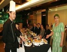 Chef Loke Hoi Weng from UCSI University and the supervising teacher from Sergili Professional College of Tashkent, Feruza Kamalova introducing the special dishes prepared by the respective students from the two institutions