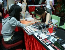 A student gets a manicure during the International Women's Week festivities at UCSI University.